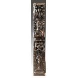 An early 17th century carved walnut term, circa 1630, carved with a male holding a bird, atop a lion