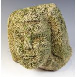 A stone head in the medieval manner, 24.5cm high (very worn)