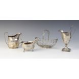 A George III silver sauce boat, William Skeen, London 1764, of typical form with shaped rim and