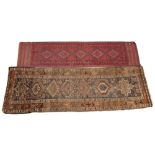 A Turkish hand knotted wool runner, in colourways of red and blue, the central panel with five