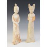 Two Chinese pottery figures of female courtesans, possibly Sui/Tang dynasty, each modelled