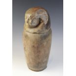 An Egyptian style limestone canopic jar, the stopper in the form of human-headed Imsety, Not