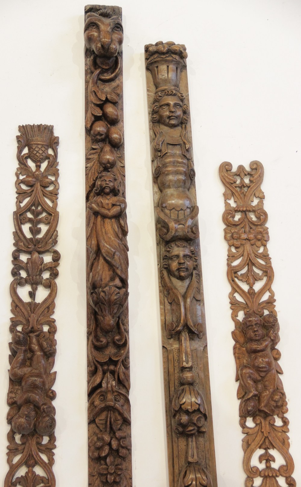 An oak carved figural pilaster, Flemish, topped by lions mask above hanging fruit, foliage and - Image 2 of 4
