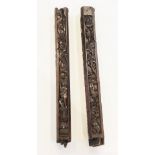 A pair of carved oak pillars, possibly part bed posts, circa 1500 and later, of canted square