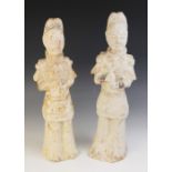 Two Chinese pottery figures of warriors, possibly Tang dynasty, each modelled standing in armour