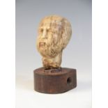 A carved marble male head, 9cm high, upon a later wooden base, 12.5cm high overall