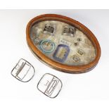 A selection of 19th century and later buckles, to include a silver coloured pair,