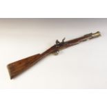 A Flintlock Blunderbuss, 19th century, the round bronze barrel stamped ‘A093’, half-stocked in