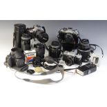 A collection of 35mm camera equipment, comprising: a Minolta XG-M 35mm single lens reflex camera,