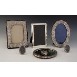 A selection of silver mounted and silver coloured photograph frames, including a rectangular example