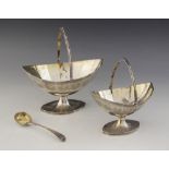 Two George III silver swing-handled sugar baskets, Charles Hougham, London 1790, the faceted navette