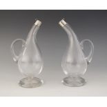 A pair of Victorian cut glass and silver mounted oil and vinegar bottles, John Round & Son,