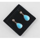 A pair of diamond and turquoise coloured drop earrings, each designed as a round brilliant cut