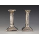 A pair of Edwardian silver candlesticks, Charles Westwood & Sons, Birmingham 1907, Corinthian