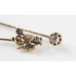 A late 19th century 14ct gold sapphire set stick pin brooch in the form of a Griffin, marks to