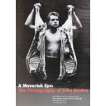 A vintage exhibition poster for 'A MAVERICK EYE: THE PHOTOGRAPHY OF JOHN DEAKIN', held at the Dean