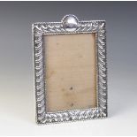 A Victorian silver mounted photograph frame, William Comyns, London 1897, of rectangular form with