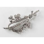 A diamond floral spray brooch, set throughout with brilliant cut and baguette cut diamonds, all