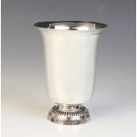 A 19th century French silver beaker, of tapering form with flared rim on raised circular foot,