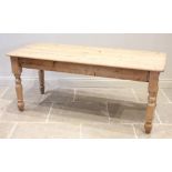 A Victorian style pine kitchen table, late 20th century, the rectangular top with rounded corners