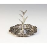 An Edwardian silver ring tree, Henry Matthews, Birmingham 1905, the circular base with shaped border