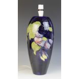 A Moorcroft 'Anemone' pattern lamp base, of tapering ovoid form against a cobalt ground, impressed