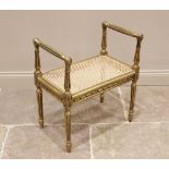 A Louis XVI style giltwood dressing stool, late 19th/early 20th century, the rectangular rattan seat