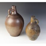 A salt glazed stoneware flagon, probably late 17th century, of typical form with narrow neck swollen
