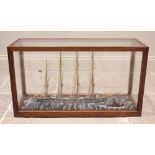 A cased model of a four masted vessel 'Trafalgar', mid 20th century, with full rigging and