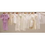 A collection of early 20th century children's clothing, to include; two cream shadow striped voile