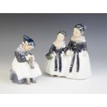 A Royal Copenhagen figural group, 20th century, modelled as two Amager girls in traditional dress