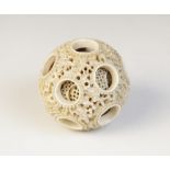 A Chinese Canton ivory puzzle ball, 19th century, carved with multiple spheres, the external example