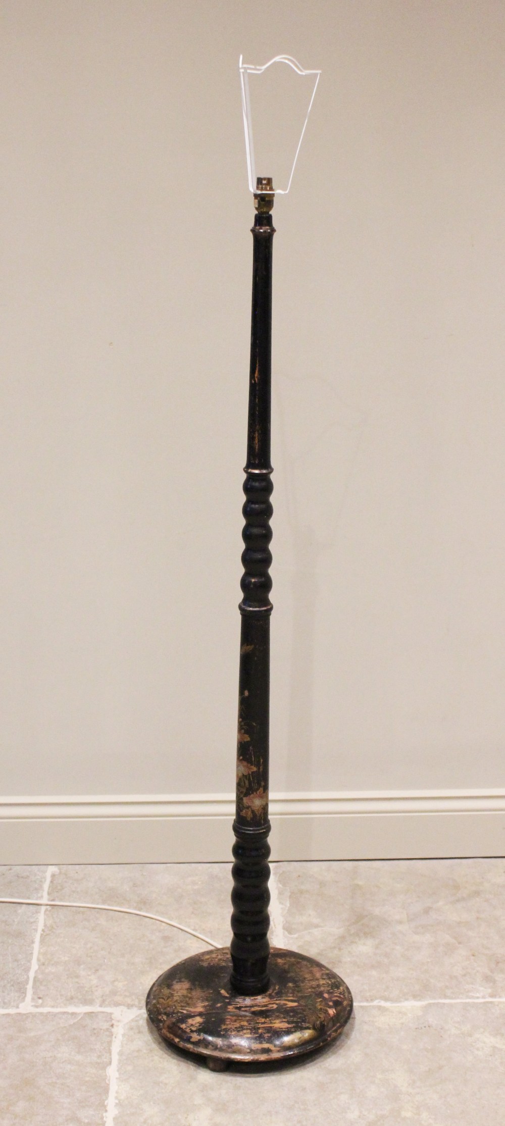 An early 20th century Chinoiserie decorated standard lamp, the bulbous and tapering column applied