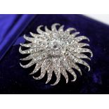 A Victorian diamond sunburst brooch/pendant, comprising a central round old cut diamond weighing