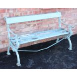 A painted iron and hardwood garden bench, late 19th century, the 'X' frame bench ends cast with a