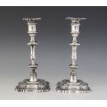 A pair of George V silver candlesticks by William & Hutton & Sons, Birmingham 1912, with waisted