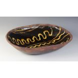 An English slipware bowl of large proportions, late 18th century, probably midlands or northern