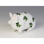 A Wemyss ware pig, 20th century, modelled seated with hand painted clover decoration to the body,