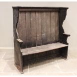 A 19th century scumbled lambing bench/settle, probably pine or elm, the high panelled back extending