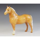 A Beswick Welsh Cob, model No. 1793 (first version) in palomino gloss, issued 1962-1970, 19cm high
