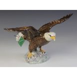 A Beswick Bald Eagle, model No. 1018 in gloss, discontinued 1995, boxed, 18.5cm high, with a Beswick