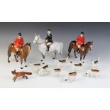 A selection of Beswick hunting models comprising; a model No. 1730 huntswoman on grey horse (