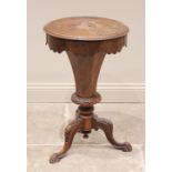 A Victorian burr walnut sewing table, of trumpet form, the circular top opening to a