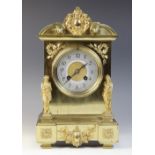 A late 19th century French brass cased mantel clock by Japy Freres, the architectural case applied