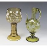 A German 'historismus' olive glass ewer, the body of compressed circular from with floral prunted