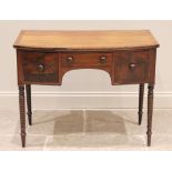 An early 19th century mahogany bow front side table, the cross banded top above an arrangement of