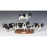 A Beswick Friesian Cow And Calf - On Wooden Plinth, model No. 1362/1249C, issued 1993-1996, 15cm