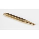 An Art Deco Cartier of London 9ct gold propelling pencil, of hexagonal form with plain polished
