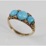 A Victorian turquoise and diamond ring, the central round turquoise cabochon measuring 7.9mm