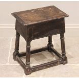 An 18th century style oak joint stool, late 19th century, the rectangular moulded top raised upon
